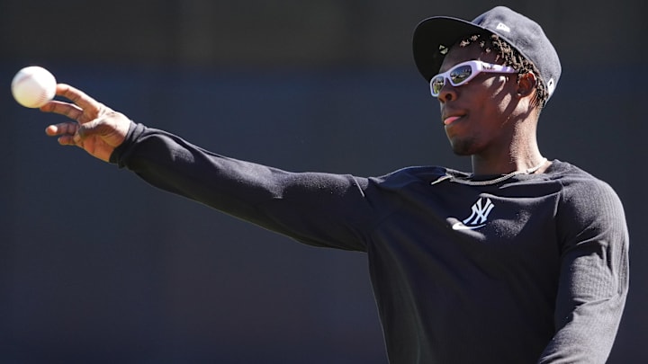 Feb 17, 2025; Tampa, FL, USA; New York Yankees third base Jazz Chisholm Jr. (13) throws the ball during spring training practice at George M. Steinbrenner Field