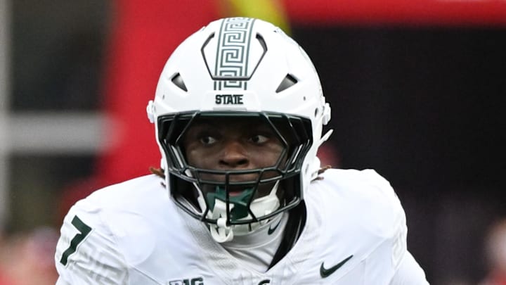 Oct 18, 2025; Bloomington, Indiana, USA; Michigan State Spartans running back Brandon Tullis (7) runs with the ball during the first half against the Indiana Hoosiers at Memorial Stadium. Mandatory Credit: Robert Goddin-Imagn Images