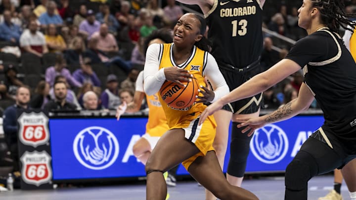 Mar 7, 2026; Kansas City, MO, USA;  West Virginia Mountaineers guard Jordan Harrison (10) drives the ball through the Colorado Buffaloes defense during the second half at T-Mobile Center. Mandatory Credit: Nick Tre. Smith-Imagn Images