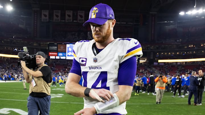 Jan 13, 2025; Glendale, AZ, USA; Minnesota Vikings quarterback Sam Darnold (14) reacts as he walks off the field after losing to the Los Angeles Rams during an NFC wild card game at State Farm Stadium. Mandatory Credit: Mark J. Rebilas-Imagn Images