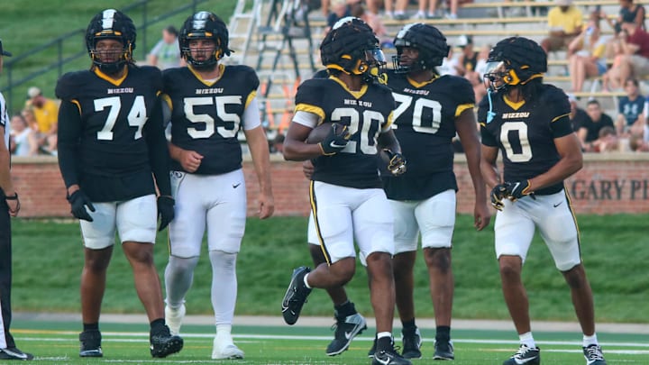Aug 17, 2024; Columbia, Missouri USA; Missouri Tigers running back Jamal Roberts (20, center) walks with the offensive line during the team's practice at Faurot Field. Aug 17, 2024; Columbia, Missouri USA; Missouri Tigers running back Jamal Roberts (20, center) walks with the offensive line during the team's practice at Faurot Field.