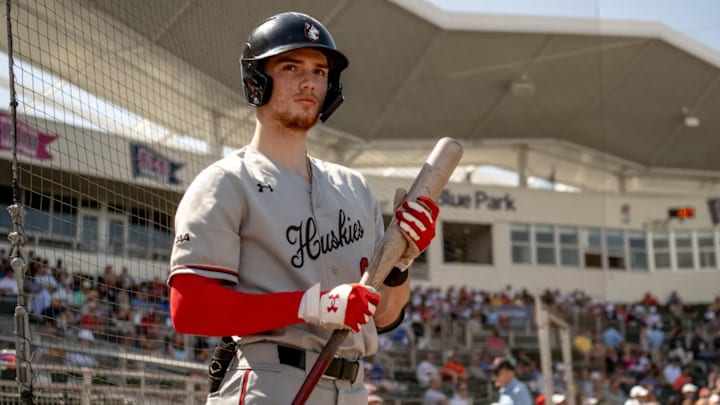 Mike Sirota walks to plate while playing for the Northeastern Huskies