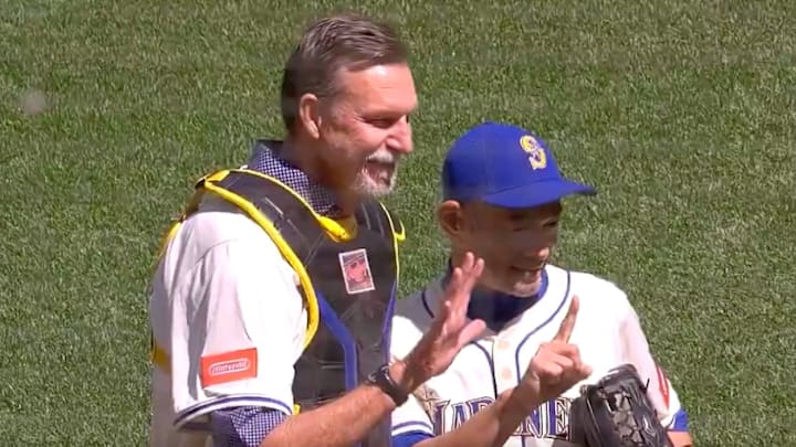 Ichiro Suzuki threw out the first pitch to Randy Johnson the day after his jersey retirement ceremony with the Mariners.