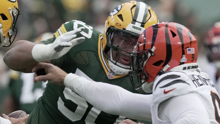 Green Bay Packers right tackle Zach Tom (50) blocks Cincinnati Bengals defensive end Trey Hendrickson. Green Bay Packers right tackle Zach Tom (50) blocks Cincinnati Bengals defensive end Trey Hendrickson.