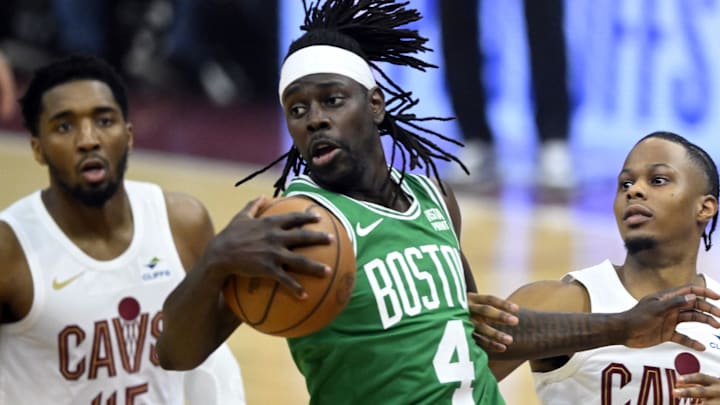May 11, 2024; Cleveland, Ohio, USA; Boston Celtics guard Jrue Holiday (4) rebounds against Cleveland Cavaliers guard Donovan Mitchell (45) and forward Isaac Okoro (35) in the first quarter of game three of the second round of the 2024 NBA playoffs at Rocket Mortgage FieldHouse. Mandatory Credit: David Richard-Imagn Images May 11, 2024; Cleveland, Ohio, USA; Boston Celtics guard Jrue Holiday (4) rebounds against Cleveland Cavaliers guard Donovan Mitchell (45) and forward Isaac Okoro (35) in the first quarter of game three of the second round of the 2024 NBA playoffs at Rocket Mortgage FieldHouse. Mandatory Credit: David Richard-Imagn Images