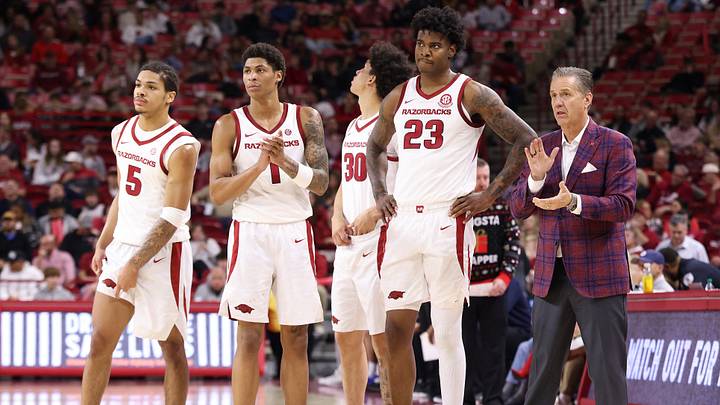 Dec 16, 2025; Fayetteville, Arkansas, USA; Arkansas Razorbacks head coach John Calipari talks to forward Nick Pringle (23), along with guards Meleek Thomas (1) and Darius Acuff Jr (5) during the second half against the Queens Royals at Bud Walton Arena. Arkansas won 108-80. Mandatory Credit: Nelson Chenault-Imagn Images Dec 16, 2025; Fayetteville, Arkansas, USA; Arkansas Razorbacks head coach John Calipari talks to forward Nick Pringle (23), along with guards Meleek Thomas (1) and Darius Acuff Jr (5) during the second half against the Queens Royals at Bud Walton Arena. Arkansas won 108-80. Mandatory Credit: Nelson Chenault-Imagn Images