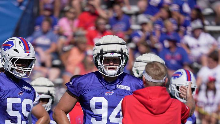 Buffalo Bills edge rushers Paris Shand and Landon Jackson listen as a coach goes over a practice route during opening day of the Buffalo Bills training camp at St. John Fisher University. Buffalo Bills edge rushers Paris Shand and Landon Jackson listen as a coach goes over a practice route during opening day of the Buffalo Bills training camp at St. John Fisher University.