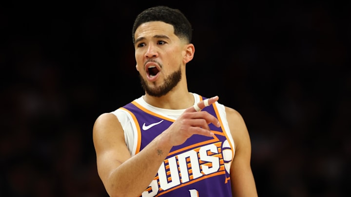 Mar 24, 2026; Phoenix, Arizona, USA; Phoenix Suns guard Devin Booker (1) reacts against the Denver Nuggets in the first half at Mortgage Matchup Center. Mandatory Credit: Mark J. Rebilas-Imagn Images