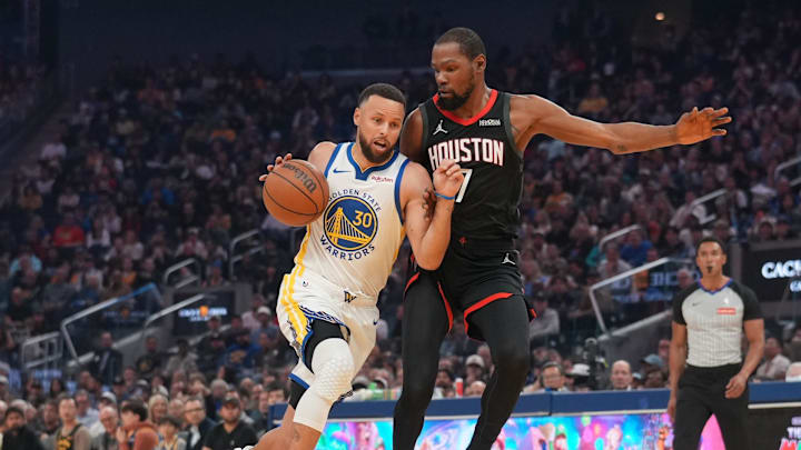 Apr 5, 2026; San Francisco, California, USA; Golden State Warriors guard Stephen Curry (30) dribbles the ball next to Houston Rockets forward Kevin Durant (7) in the first quarter at the Chase Center. Mandatory Credit: Cary Edmondson-Imagn Images