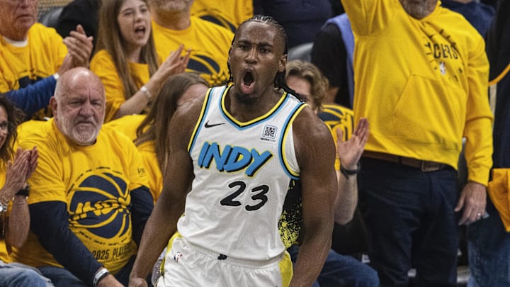 Apr 19, 2025; Indianapolis, Indiana, USA;  Indiana Pacers forward Aaron Nesmith (23) celebrates a made basket  in the first half against the Milwaukee Bucks at Gainbridge Fieldhouse. Mandatory Credit: Trevor Ruszkowski-Imagn Images