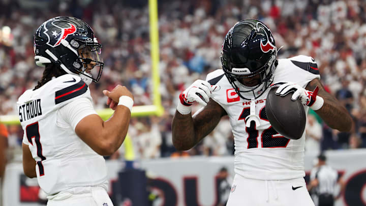 Sep 15, 2025; Houston, Texas, USA; Houston Texans wide receiver Nico Collins (12) celebrates with Houston Texans quarterback C.J. Stroud (7) after scoring a touchdown during the first quarter against the Tampa Bay Buccaneers at NRG Stadium. Mandatory Credit: Thomas Shea-Imagn Images