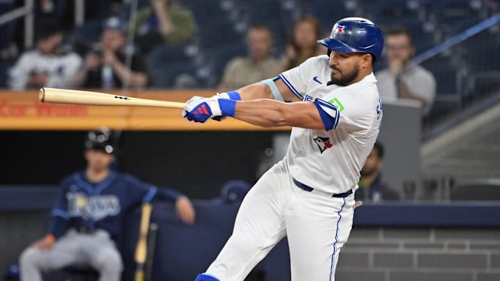 May 14, 2025; Toronto, Ontario, CAN;  Toronto Blue Jays designated hitter Anthony Santander (25) hits a single against the Tampa Bay Rays in the first inning at Rogers Centre. 