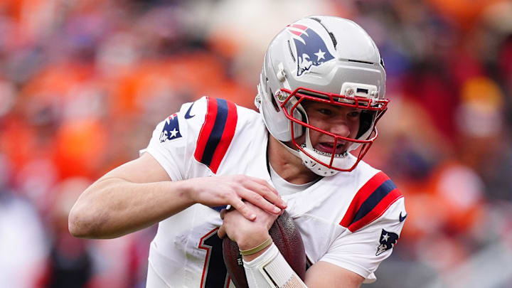 Jan 25, 2026; Denver, CO, USA; New England Patriots quarterback Drake Maye (10) rushes the ball for a touchdown against the Denver Broncos during the first half in the 2026 AFC Championship Game at Empower Field at Mile High. Mandatory Credit: Ron Chenoy-Imagn Images