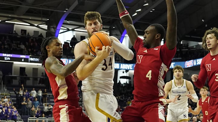 Nebraska's Ahron Ulis (2) and Juwan Gary (4) defend against Northwestern center Matthew Nicholson (34) during the first half. Nebraska's Ahron Ulis (2) and Juwan Gary (4) defend against Northwestern center Matthew Nicholson (34) during the first half.