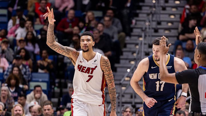 Feb 11, 2026; New Orleans, Louisiana, USA; Miami Heat center Kel'el Ware (7) reacts to making a three point basket against New Orleans Pelicans forward/center Karlo Matković (17) during the second half at Smoothie King Center. Mandatory Credit: Stephen Lew-Imagn Images