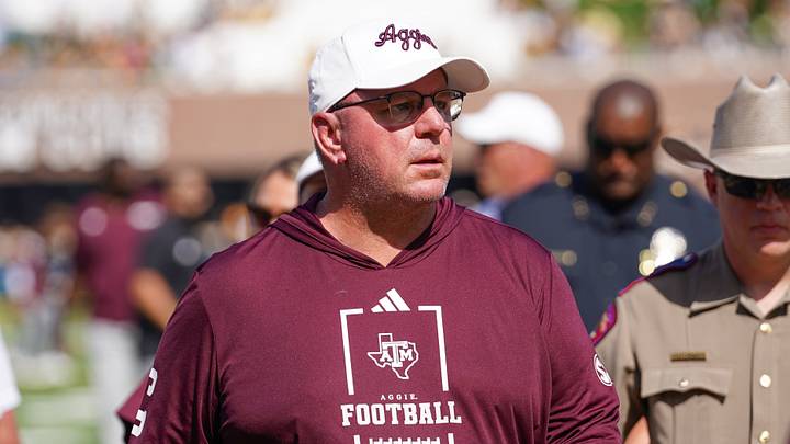 Texas A&M Aggies head coach Mike Elko leaves the field after the first half against the Missouri Tigers during the first half of the game at Faurot Field at Memorial Stadium. 