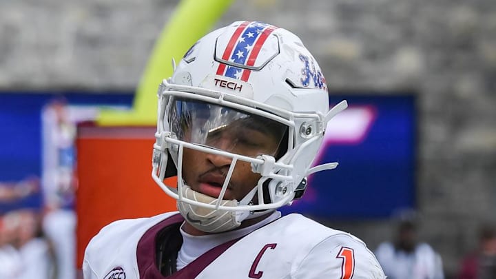 Sep 20, 2025; Blacksburg, Virginia, USA;  Virginia Tech Hokies quarterback Kyron Drones (1) after a touchdown run during the fourth quarter against the Wofford Terriers at Lane Stadium. Mandatory Credit: Brian Bishop-Imagn Images