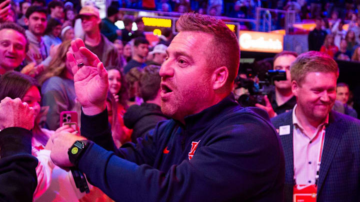 Newly hired Auburn football head coach Alex Golesh greets fans before Auburn Tigers take on NC State Wolfpack at Neville Arena in Auburn, Ala. on Wednesday, Dec. 3, 2025. Newly hired Auburn football head coach Alex Golesh greets fans before Auburn Tigers take on NC State Wolfpack at Neville Arena in Auburn, Ala. on Wednesday, Dec. 3, 2025.