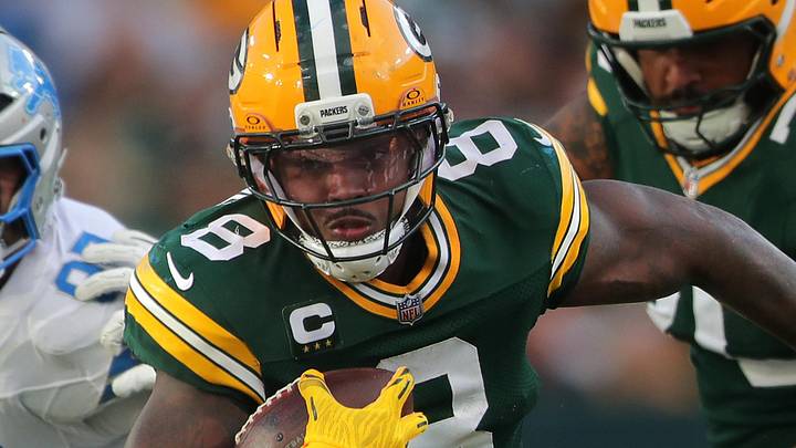 Green Bay Packers running back Josh Jacobs (8) runs with the ball against the Detroit Lions at Lambeau Field.