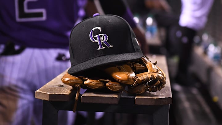 Aug 4, 2017; Denver, CO, USA; General view of the hat and glove of Colorado Rockies shortstop Pat Valaika (4) (not pictured) in the seventh inning against the Philadelphia Phillies at Coors Field. Mandatory Credit: Ron Chenoy-Imagn Images