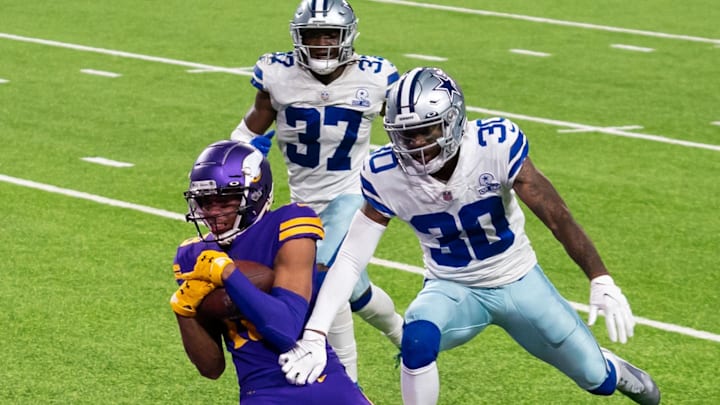 Minnesota Vikings wide receiver Justin Jefferson catches a touchdown against Dallas Cowboys cornerback Anthony Brown Minnesota Vikings wide receiver Justin Jefferson catches a touchdown against Dallas Cowboys cornerback Anthony Brown