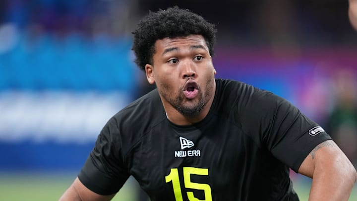 Feb 27, 2025; Indianapolis, IN, USA; Oregon defensive lineman Derrick Harmon (DL15) participates in drills during the 2025 NFL Combine at Lucas Oil Stadium. Mandatory Credit: Kirby Lee-Imagn Images