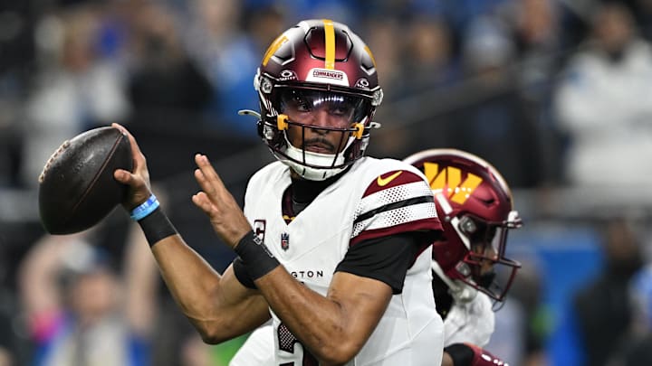 Jan 18, 2025; Detroit, Michigan, USA; Washington Commanders quarterback Jayden Daniels (5) throws a pass during the first quarter against Detroit Lions in a 2025 NFC divisional round game at Ford Field. Mandatory Credit: Lon Horwedel-Imagn Images