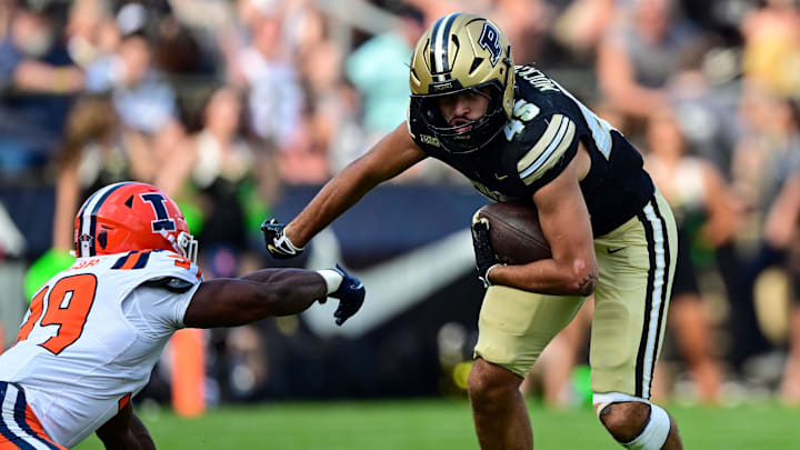 Purdue Boilermakers running back Devin Mockobee (45) runs with the ball against Illinois Fighting Illini Purdue Boilermakers running back Devin Mockobee (45) runs with the ball against Illinois Fighting Illini
