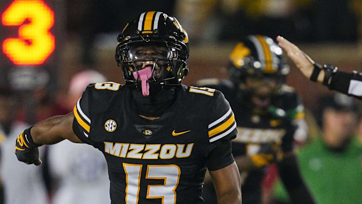 Nov 9, 2024; Columbia, Missouri, USA; Missouri Tigers safety Daylan Carnell (13) celebrates after forcing a fumble during the second half against the Oklahoma Sooners at Faurot Field at Memorial Stadium. Mandatory Credit: Jay Biggerstaff-Imagn Images Nov 9, 2024; Columbia, Missouri, USA; Missouri Tigers safety Daylan Carnell (13) celebrates after forcing a fumble during the second half against the Oklahoma Sooners at Faurot Field at Memorial Stadium. Mandatory Credit: Jay Biggerstaff-Imagn Images