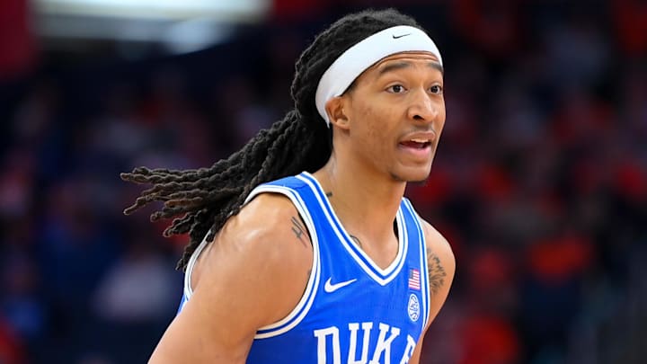 Duke forward Maliq Brown dribbles the ball down the court.