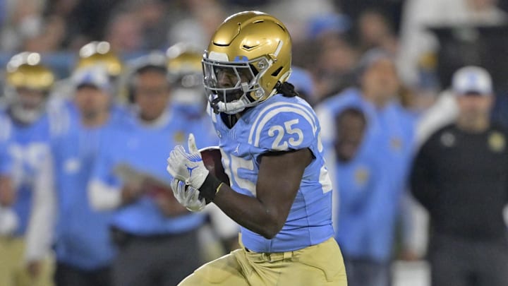 Nov 8, 2024; Pasadena, California, USA; UCLA Bruins running back T.J. Harden (25) carries for a gain in the first half against the Iowa Hawkeyes at the Rose Bowl. Mandatory Credit: Jayne Kamin-Oncea-Imagn Images Nov 8, 2024; Pasadena, California, USA; UCLA Bruins running back T.J. Harden (25) carries for a gain in the first half against the Iowa Hawkeyes at the Rose Bowl. Mandatory Credit: Jayne Kamin-Oncea-Imagn Images
