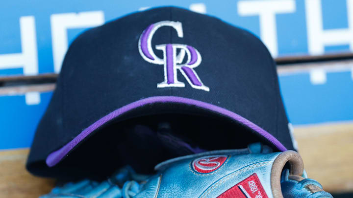 Apr 23, 2022; Detroit, Michigan, USA;  Colorado Rockies cap and glove in the dugout during the game against the Detroit Tigers at Comerica Park. Mandatory Credit: Rick Osentoski-Imagn Images