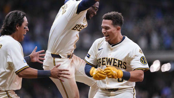 Aug 26, 2025; Milwaukee, Wisconsin, USA;  Milwaukee Brewers left fielder Isaac Collins (6) celebrates with teammates after driving in the winning run during the ninth inning against the Arizona Diamondbacks at American Family Field. Mandatory Credit: Jeff Hanisch-Imagn Images