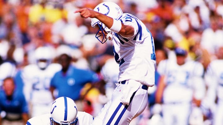 Sep 26, 1999; San Diego, CA, USA; FILE PHOTO; Indianapolis Colts kicker Mike Vanderjagt (12) kicks out of the hold of Steve Walsh (4) against the San Diego Chargers at Qualcomm Stadium. 