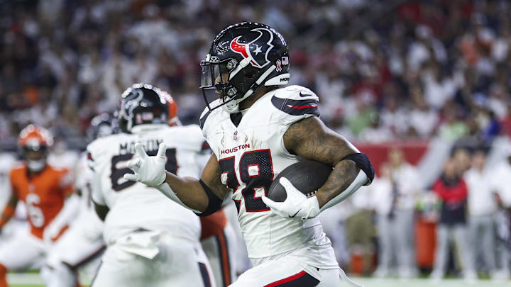 Sep 15, 2024; Houston, Texas, USA; Houston Texans running back Joe Mixon (28) runs with the ball during the third quarter against the Chicago Bears at NRG Stadium. Mandatory Credit: Troy Taormina-Imagn Images