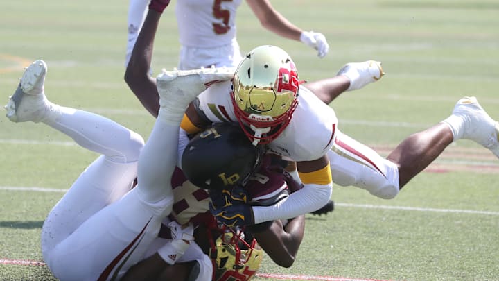 Iona prep's Steven Dowdy Jr. is tackled by Bergen Catholic's Kaden Irby-Mason, left, and Jordan Thomas during their game at Iona Prep Sept. 14, 2024. Bergen Catholic won 31-10. Iona prep's Steven Dowdy Jr. is tackled by Bergen Catholic's Kaden Irby-Mason, left, and Jordan Thomas during their game at Iona Prep Sept. 14, 2024. Bergen Catholic won 31-10.