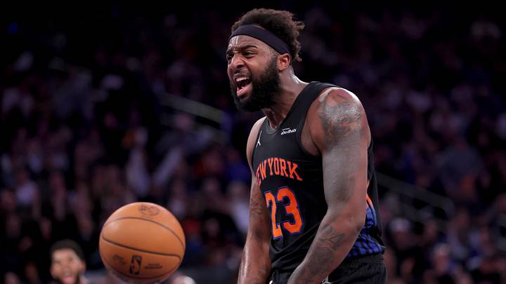 Dec 19, 2025; New York, New York, USA; New York Knicks center Mitchell Robinson (23) reacts after a dunk against the Philadelphia 76ers during the second quarter at Madison Square Garden. Mandatory Credit: Brad Penner-Imagn Images