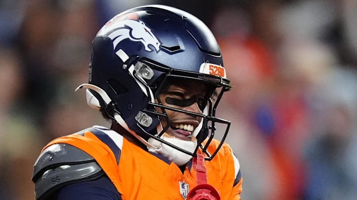 Dec 14, 2025; Denver, Colorado, USA; Denver Broncos wide receiver Troy Franklin (11) celebrates a touchdown during the third quarter against the Green Bay Packers at Empower Field at Mile High. Mandatory Credit: Ron Chenoy-Imagn Images