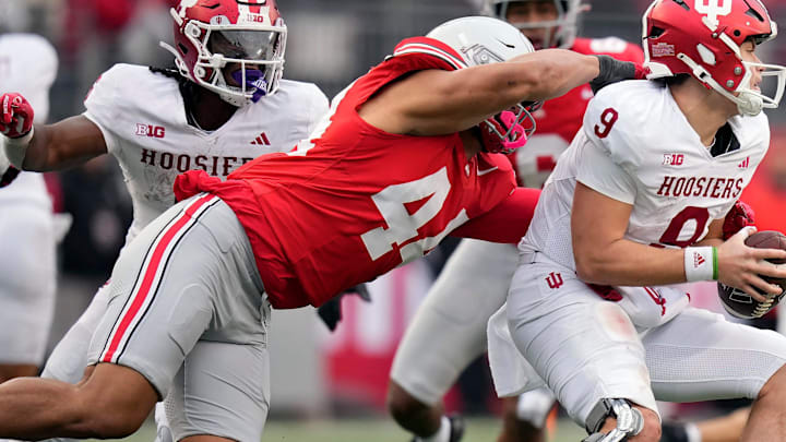 Ohio State Buckeyes defensive end JT Tuimoloau (44) sacks Indiana Hoosiers quarterback Kurtis Rourke (9) in the third quarter during the football game in Columbus on Saturday, Nov. 23, 2024.