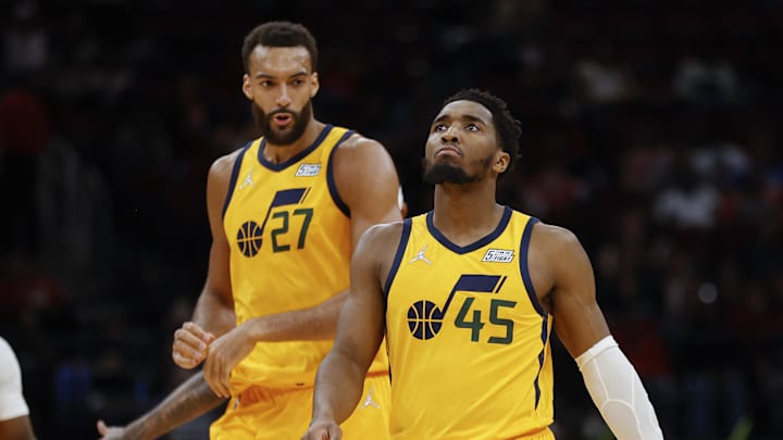 Mar 2, 2022; Houston, Texas, USA; Utah Jazz guard Donovan Mitchell (45) and center Rudy Gobert (27) react after a play during the third quarter against the Houston Rockets at Toyota Center. Mandatory Credit: Troy Taormina-Imagn Images