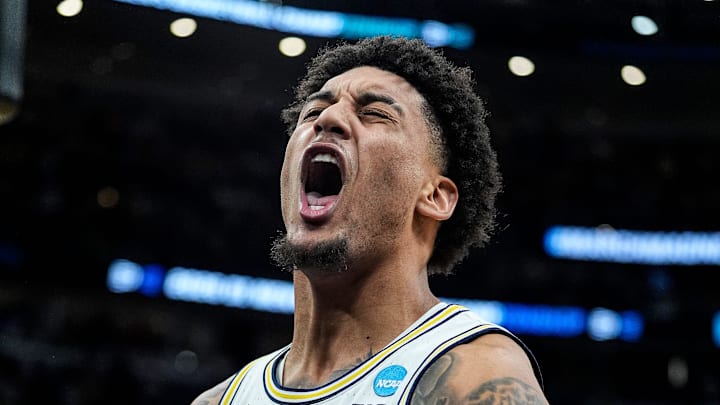 Michigan forward Yaxel Lendeborg (23) celebrates a dunk against Tennessee during the second half of NCAA Tournament Elite 8 round at United Center in Chicago on Sunday, March 29, 2026.