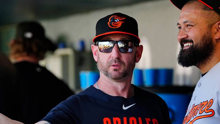 Sep 2, 2026; Denver, Colorado, USA;  Baltimore Orioles manager Craig Albernaz (55) and Baltimore Orioles pitcher Rico Garcia (50) talk during the game against the Colorado Rockies  at Coors Field.  Mandatory Credit: Ron Chenoy-Imagn Images