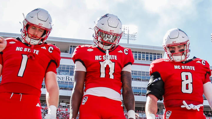 Oct 4, 2025; Raleigh, North Carolina, USA; NC State Wolfpack quarterback CJ Bailey (11), linebacker Caden Fordham (1), wide receiver Keenan Jackson (8) during the coin toss prior to the first half of the game against Campbell Fighting Camels at Carter-Finley Stadium. Mandatory Credit: Jaylynn Nash-Imagn Images Oct 4, 2025; Raleigh, North Carolina, USA; NC State Wolfpack quarterback CJ Bailey (11), linebacker Caden Fordham (1), wide receiver Keenan Jackson (8) during the coin toss prior to the first half of the game against Campbell Fighting Camels at Carter-Finley Stadium. Mandatory Credit: Jaylynn Nash-Imagn Images