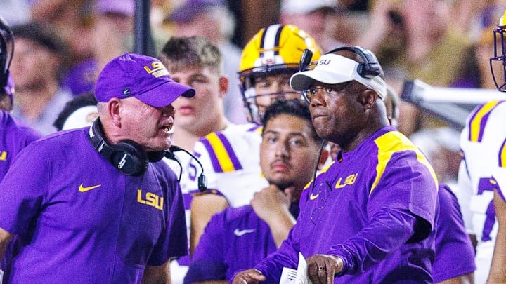 Sep 6, 2025; Baton Rouge, Louisiana, USA; LSU Tigers head coach Brian Kelly reacts against associate head coach Frank Wilson during the second half against Louisiana Tech Bulldogs at Tiger Stadium. Mandatory Credit: Stephen Lew-Imagn Images Sep 6, 2025; Baton Rouge, Louisiana, USA; LSU Tigers head coach Brian Kelly reacts against associate head coach Frank Wilson during the second half against Louisiana Tech Bulldogs at Tiger Stadium. Mandatory Credit: Stephen Lew-Imagn Images
