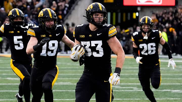 Iowa Hawkeyes linebacker Cam Buffington (33) runs the ball after intercepting a pass during a game against the Minnesota Golden Gophers Oct. 25, 2025 at Kinnick Stadium in Iowa City, Iowa. Iowa Hawkeyes linebacker Cam Buffington (33) runs the ball after intercepting a pass during a game against the Minnesota Golden Gophers Oct. 25, 2025 at Kinnick Stadium in Iowa City, Iowa.