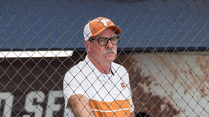 Texas Longhorns head coach Mike White watches the Texas Tech Red Raiders warm up.