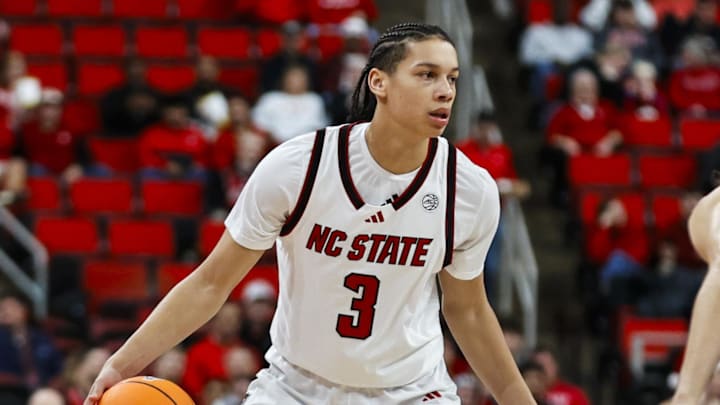 Dec 6, 2025; Raleigh, North Carolina, USA; NC State Wolfpack guard Matt Able (3) dribbles the ball against UNC Asheville Bulldogs guard Corey Jones (24) during the first half of the game at Lenovo Center. Mandatory Credit: Jaylynn Nash-Imagn Images Dec 6, 2025; Raleigh, North Carolina, USA; NC State Wolfpack guard Matt Able (3) dribbles the ball against UNC Asheville Bulldogs guard Corey Jones (24) during the first half of the game at Lenovo Center. Mandatory Credit: Jaylynn Nash-Imagn Images
