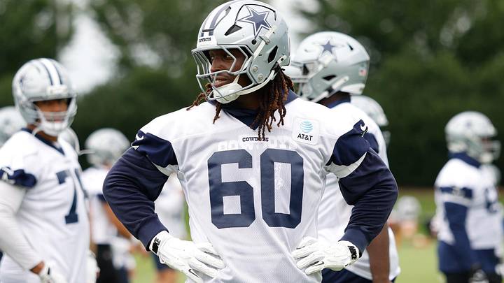 Dallas Cowboys offensive tackle Tyler Guyton goes through a drill during practice at the Ford Center. Dallas Cowboys offensive tackle Tyler Guyton goes through a drill during practice at the Ford Center.