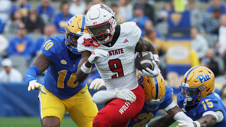 Oct 25, 2025; Pittsburgh, Pennsylvania, USA;  North Carolina State Wolfpack wide receiver Terrell Anderson (9) runs with the ball after a catch against the Pittsburgh Panthers during the first quarter at Acrisure Stadium. Mandatory Credit: Charles LeClaire-Imagn Images