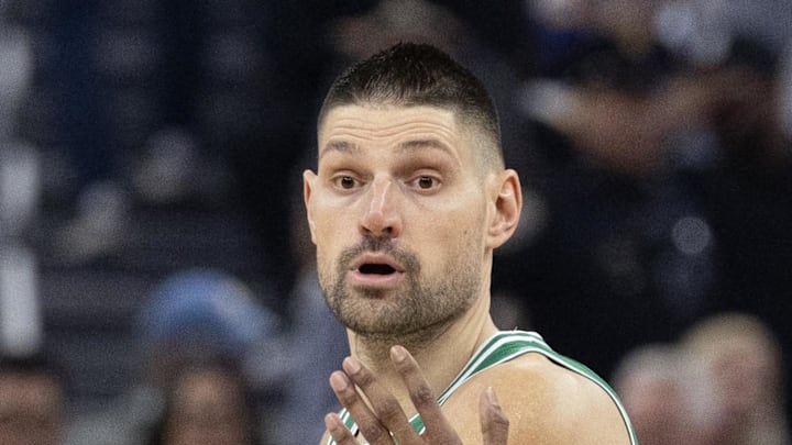 Feb 19, 2026; San Francisco, California, USA; Boston Celtics center Nikola Vucevic (4) looks to pass around Golden State Warriors guard De'Anthony Melton (8) during the first quarter at Chase Center. Mandatory Credit: D. Ross Cameron-Imagn Images